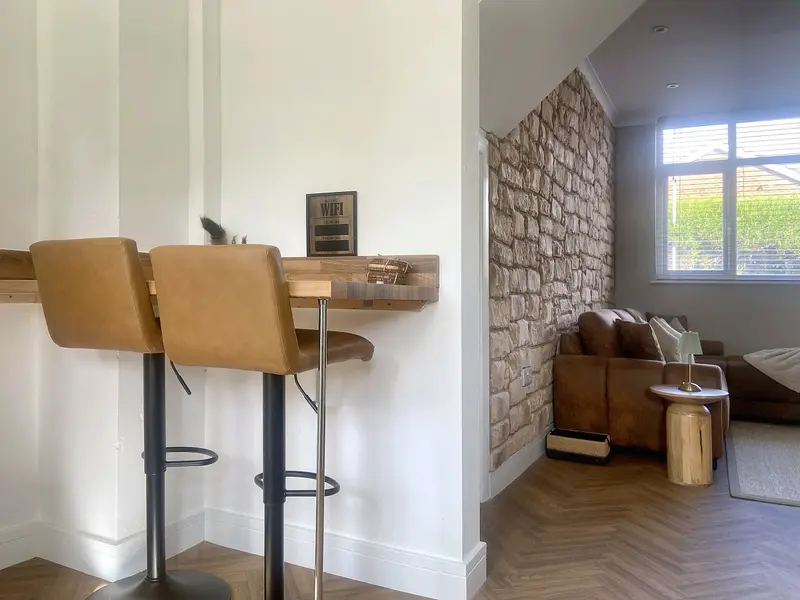 Breakfast bar for two with tan bar stools