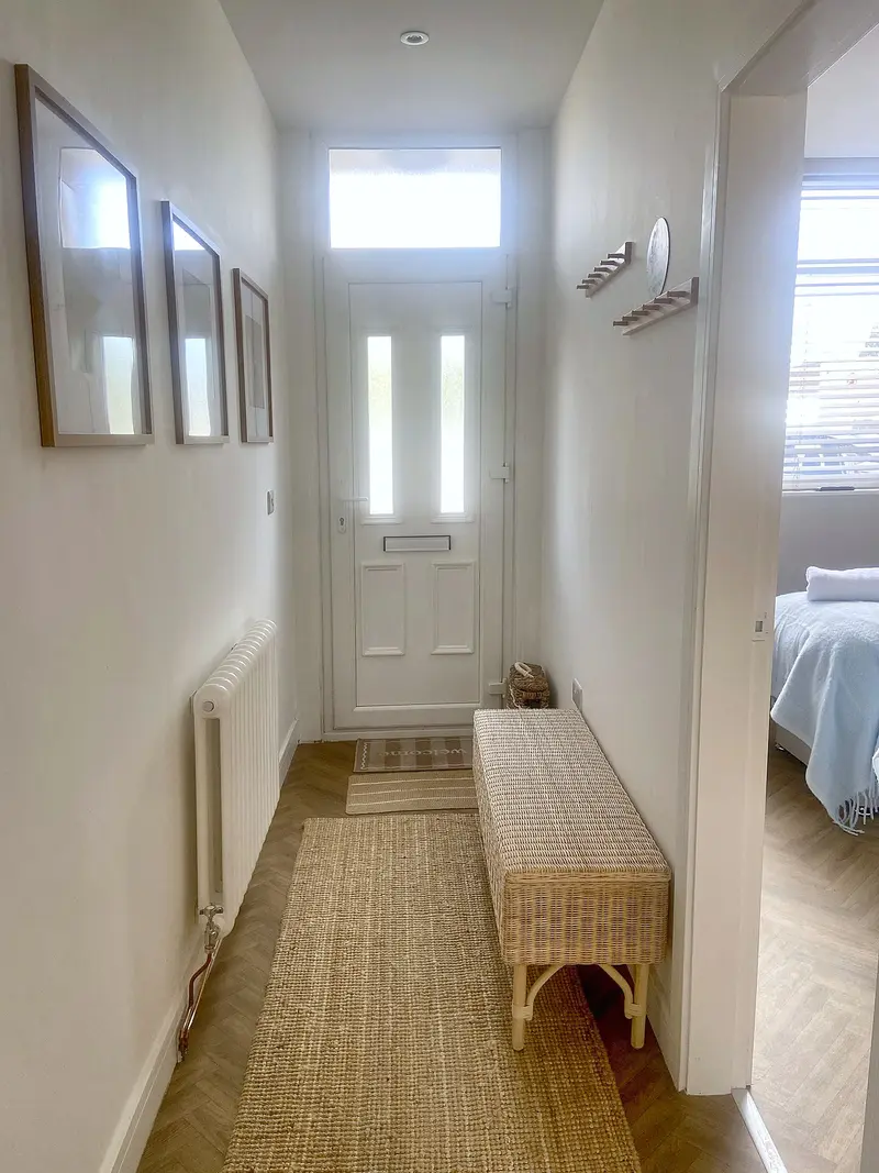 Hallway leading to the private front door